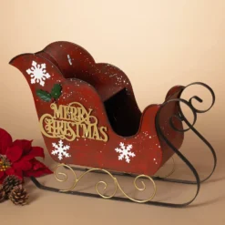 19-Inch Red Metal Mini Santa Sleigh W/Golden Merry Christmas Greeting, White Snowflakes, Holly And Berry Accents – Decorative Metallic Tabletop Decoration – Winter Xmas Home Decor