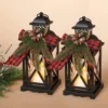 Set Of 2 10.5-Inch Rustic Metal Lighted Holiday Lantern Candle Holders With Greenery And Ribbon Accents And Timer – Hanging Or Tabletop LED Christmas Decoration – Indoor Outdoor Winter Home Decor